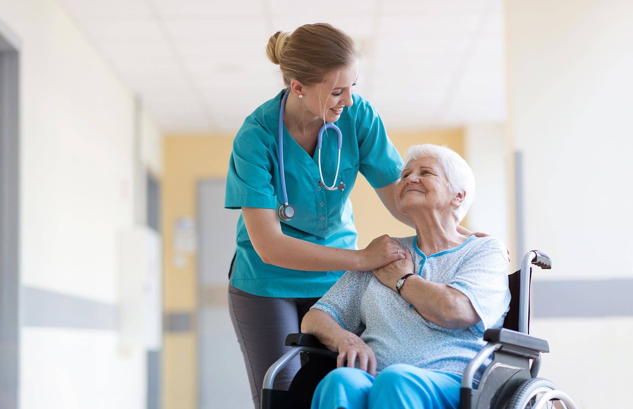 Female nurse with elderly female patient in wheelchair.